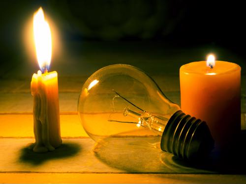 Candle and loose light bulb